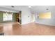 Open-concept living area with hardwood floors, neutral paint, and a partial view of the adjacent kitchen at 3599 Salem Glen Rd, Lithonia, GA 30038