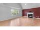 Bright living room with hardwood floors, a fireplace, and large windows offering natural light at 3599 Salem Glen Rd, Lithonia, GA 30038
