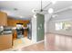 Open-concept living area featuring hardwood floors, modern lighting, and seamless transition to the kitchen at 3599 Salem Glen Rd, Lithonia, GA 30038