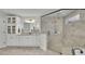 Bathroom with double vanity, granite countertop, and a frameless glass shower with tile surround at 7190 Tributary Ct, Cumming, GA 30040