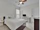 Bright bedroom with a comfortable bed, desk area, and ample natural light, creating a cozy retreat at 7190 Tributary Ct, Cumming, GA 30040