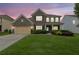 Charming two-story brick home with a well-manicured lawn and welcoming front porch at 7190 Tributary Ct, Cumming, GA 30040