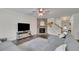 Bright living room boasts a stone fireplace and plush sofa, creating a comfortable and inviting space for relaxation at 7190 Tributary Ct, Cumming, GA 30040