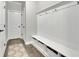 Well-organized mudroom offers storage with hooks and baskets, ideal for keeping belongings tidy and accessible at 7190 Tributary Ct, Cumming, GA 30040