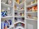Walk-in pantry with ample shelving, providing generous storage space for food and kitchen essentials at 7190 Tributary Ct, Cumming, GA 30040