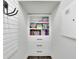 Organized storage closet featuring built-in shelving and drawers for ample storage space at 7190 Tributary Ct, Cumming, GA 30040