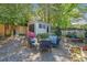 Landscaped backyard features an outdoor seating area, shed, fencing, and lush greenery at 755 Monticello Se Way, Marietta, GA 30067
