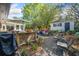 Spacious backyard with an outdoor dining area, shed, landscaping, lounge furniture, and stone accents at 755 Monticello Se Way, Marietta, GA 30067