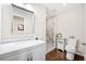Bright bathroom with walk-in shower, new vanity, marble countertop and modern fixtures at 755 Monticello Se Way, Marietta, GA 30067