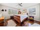 Comfortable bedroom with hardwood floors, ceiling fan, lots of windows, and natural light at 755 Monticello Se Way, Marietta, GA 30067