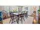 Elegant dining room with a large table, Windsor chairs, and natural light from the shuttered windows at 755 Monticello Se Way, Marietta, GA 30067