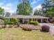 Charming single-story brick home with landscaped front yard, mature trees, and welcoming curb appeal at 755 Monticello Se Way, Marietta, GA 30067