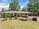 Charming single-story home with brick facade, manicured landscaping, and a lush green lawn at 755 Monticello Se Way, Marietta, GA 30067