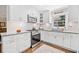 Bright, updated kitchen featuring white cabinets, subway tile backsplash, and granite countertops at 755 Monticello Se Way, Marietta, GA 30067