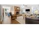 Cozy living room featuring a brick fireplace, hardwood floors, and an open floor plan at 755 Monticello Se Way, Marietta, GA 30067