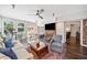 Spacious living room with hardwood floors, ceiling fan, fireplace, and lots of natural light at 755 Monticello Se Way, Marietta, GA 30067