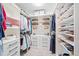 Well-organized walk-in closet with shelving, drawers, and hanging space for clothes, shoes, and accessories at 755 Monticello Se Way, Marietta, GA 30067