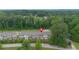 Aerial view of well-maintained townhomes with lush greenery and neighborhood streets at 2022 Talmai Dr, Snellville, GA 30078