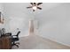 Spacious bedroom with carpet flooring, ceiling fan, and walk-in closet at 2022 Talmai Dr, Snellville, GA 30078