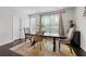 Bright dining room featuring neutral decor, hardwood floors, and natural light at 2022 Talmai Dr, Snellville, GA 30078