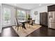 Charming dining area featuring elegant furnishings, hardwood floors, and natural light at 2022 Talmai Dr, Snellville, GA 30078