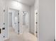 Bright hallway with neutral paint and carpet flooring at 2022 Talmai Dr, Snellville, GA 30078