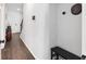 Inviting foyer hallway with dark wood floors and a coat rack nook near the front door at 2022 Talmai Dr, Snellville, GA 30078