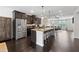 Spacious kitchen with granite island and modern stainless steel appliances and open floorplan at 2022 Talmai Dr, Snellville, GA 30078