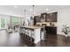 Well-appointed kitchen with granite countertops, stainless steel appliances, and a kitchen island at 2022 Talmai Dr, Snellville, GA 30078