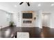 Bright living room features a modern fireplace, large windows, and stylish decor at 2022 Talmai Dr, Snellville, GA 30078