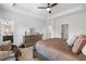 Spacious main bedroom features comfortable seating area, walk in closet, and en suite bathroom at 2022 Talmai Dr, Snellville, GA 30078
