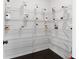 Well-organized pantry featuring white wire shelving and containers with uniform labeling at 2022 Talmai Dr, Snellville, GA 30078