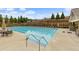 An inviting community pool with lounge chairs offers a refreshing outdoor space for residents to enjoy at 2022 Talmai Dr, Snellville, GA 30078