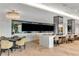 Entertainment room with multiple large screen TVs, bar seating, and a stylish contemporary design at 2425 Peachtree Ne Rd # 902, Atlanta, GA 30305