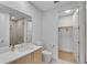 Modern bathroom with a vanity, toilet, and a glass-enclosed shower, providing a spa-like experience at 2425 Peachtree Ne Rd # 902, Atlanta, GA 30305