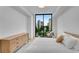 Comfortable bedroom with a large window showcasing city views, creating a serene atmosphere at 2425 Peachtree Ne Rd # 902, Atlanta, GA 30305