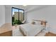 Sunlit bedroom featuring a large window with city views and modern decor at 2425 Peachtree Ne Rd # 902, Atlanta, GA 30305