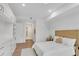 Cozy bedroom with ample natural light, closet, wood flooring, and neutral décor at 2425 Peachtree Ne Rd # 902, Atlanta, GA 30305