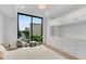 Inviting bedroom with floor-to-ceiling window and custom built-in cabinetry for ample storage at 2425 Peachtree Ne Rd # 902, Atlanta, GA 30305