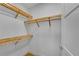 Spacious closet featuring wooden shelving and ample storage space for clothes and accessories at 2425 Peachtree Ne Rd # 902, Atlanta, GA 30305