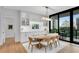 Elegant dining room with modern lighting, built-in cabinets, and a view of the cityscape at 2425 Peachtree Ne Rd # 902, Atlanta, GA 30305