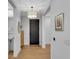 Modern entryway features hardwood floors, neutral walls, and stylish light fixture at 2425 Peachtree Ne Rd # 902, Atlanta, GA 30305