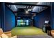 Home golf simulator room with advanced display and comfortable seating for an immersive and realistic golfing experience at 2425 Peachtree Ne Rd # 902, Atlanta, GA 30305
