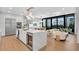 Open concept kitchen with a large island, stainless steel appliances, and hardwood flooring at 2425 Peachtree Ne Rd # 902, Atlanta, GA 30305