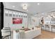 Cozy living room featuring custom built-ins, modern furnishings and open access to the kitchen at 2425 Peachtree Ne Rd # 902, Atlanta, GA 30305