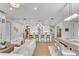 Bright, open-concept living space features modern furnishings, a large island and contemporary lighting fixtures at 2425 Peachtree Ne Rd # 902, Atlanta, GA 30305