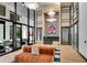 Modern lobby area featuring stylish furniture, glass-enclosed conference room, and contemporary lighting for a sophisticated ambiance at 2425 Peachtree Ne Rd # 902, Atlanta, GA 30305