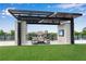 Relaxing outdoor lounge area with covered seating, a TV, and city views at 2425 Peachtree Ne Rd # 902, Atlanta, GA 30305