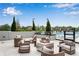 Modern patio with an inviting fire pit and comfortable seating by the pool at 2425 Peachtree Ne Rd # 902, Atlanta, GA 30305