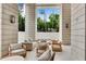 Stylish outdoor patio with comfortable seating, stone columns, and a view of the surrounding greenery at 2425 Peachtree Ne Rd # 902, Atlanta, GA 30305